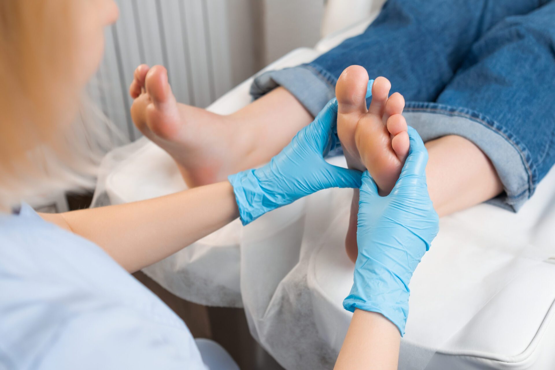 Professional foot massage for woman at a beauty salon Dr. Ramsey Joudeh, MD treatment on procressing